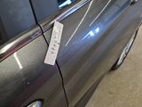 a sticker on the door of a car with a price tag attached to it