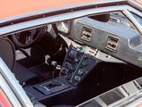 a car dashboard with a clock and a steering wheel