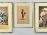three framed pictures of men in uniforms and hats on a wall