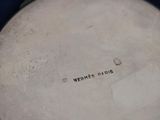 a silver plate with the words hermes paris on it