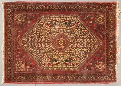 tapis persan antique à motif de médaillon sur fond rouge