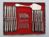 a red box with a set of silverware in it