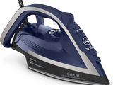a close up of a blue and white steam iron on a white surface