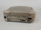 a small game console with a game on top of it