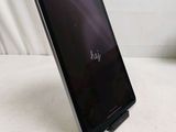 a tablet that is sitting on a stand on a table
