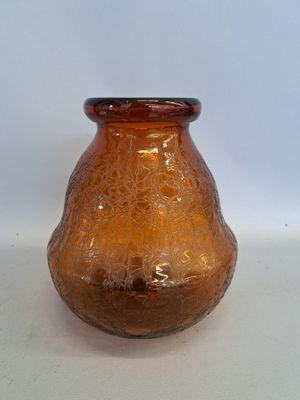 a glass vase that is sitting on a table