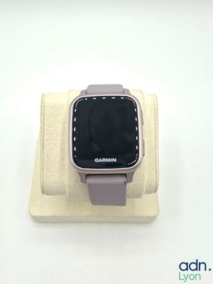 a smart watch that is sitting on top of a stand
