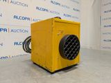 the yellow heater is sitting on the floor in front of a wall