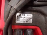 a close up of a red and black electrical device
