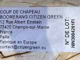 a close up of a business card on a pile of papers