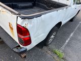 a white truck that is parked in a parking lot