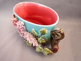 a blue and red bowl with a bird on it