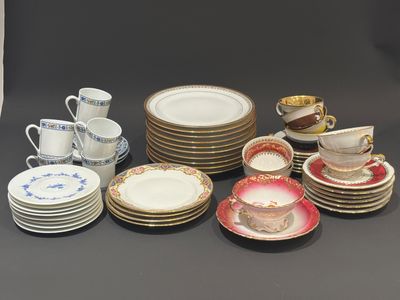 a lot of plates and cups on the table