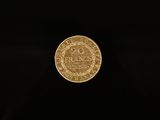 a gold coin on a black background