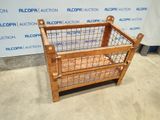 an image of a wooden crate with a wire basket on top of it