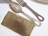 two spoons and a fork sitting on a table