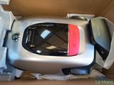 a box with a vacuum cleaner and other items inside of it