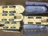 four different models of a boat on the floor