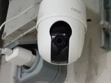 a surveillance camera mounted on the side of a building