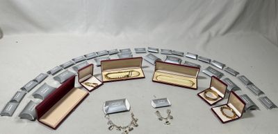 several pieces of jewelry are arranged in a circle on a white surface