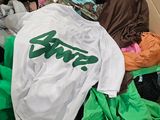 a cardboard box filled with clothes and a t - shirt