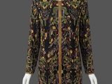 a black and gold embroidered dress with gold trim