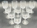 many glasses that are sitting on a table