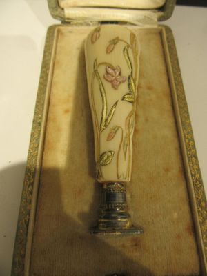 a small glass vase in a box on a table