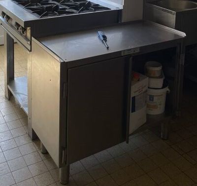 an image of a kitchen with a stove and a sink