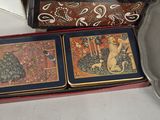 two tins that are sitting on a table next to each other