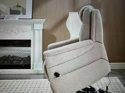a recliner that is sitting in front of a fire place