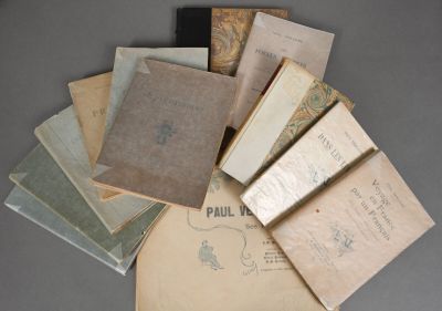 a pile of old books sitting on a table