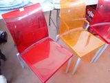 four chairs that are sitting next to each other on a table