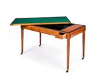 a small table with a green top and a drawer underneath it