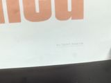 a black table with a white and orange sign on it
