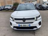 a picture of a white car parked in a parking lot