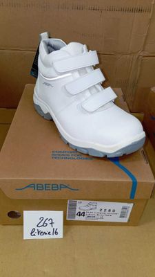 a box with a pair of white shoes on it