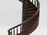 an image of a wooden spiral staircase on a stand