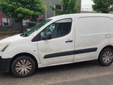 a white van parked on the side of the road