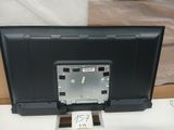 a picture of a computer monitor with a clock on top of it