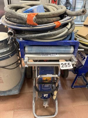 a lot of hoses on a cart in a room