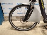 a bike that is parked in front of a wall