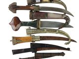several different types of knives are lined up on a white surface