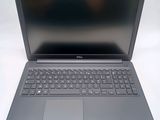 the dell laptop is open and ready to be used