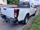 a white pick up truck parked on the side of the road