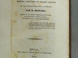 an open book with a black and white title on it
