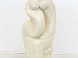 marble sculpture of a woman holding a baby in her arms