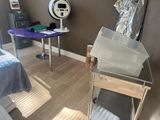 a room with a bed, a desk and a chair in it