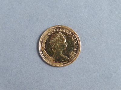 an image of a gold coin on a white surface