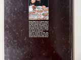 a book with a picture of a man eating a meal